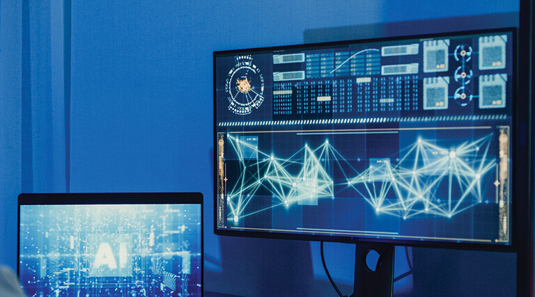 developer works on AI algorithm on multiple monitors