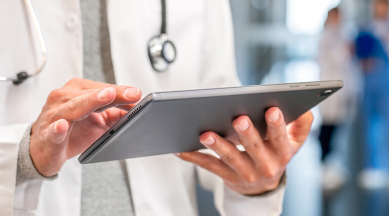 Doctor using tablet