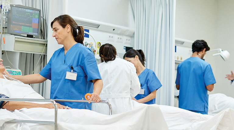 nurses talk to patients on gurneys