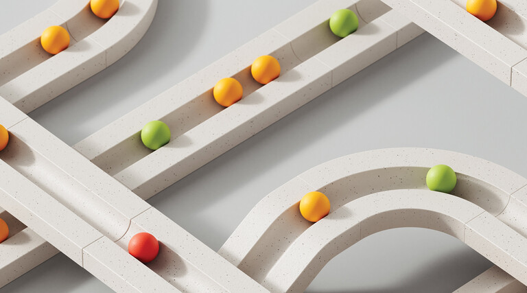 colorful marbles move through white paths