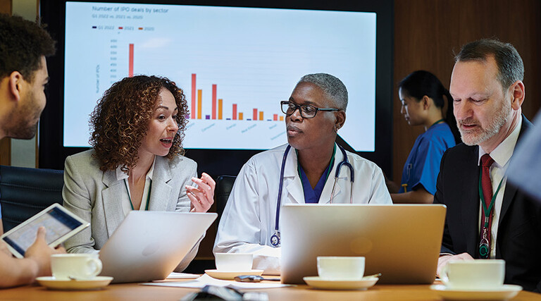 clinicians and IT team meeting