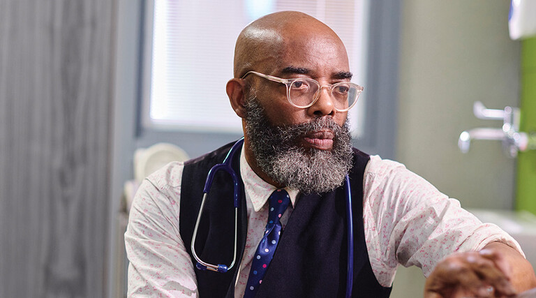 Physician working on a computer