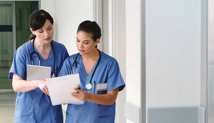 nurses with paper charts