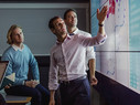 group of workers looking at genomic data presentation