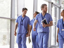 doctors walking through hospital chatting