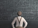 man in fedora looking at chalk maze