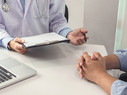 A doctor consults a patient.