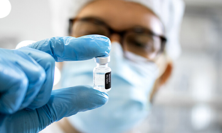Pharmaceutical worker reviewing vaccine