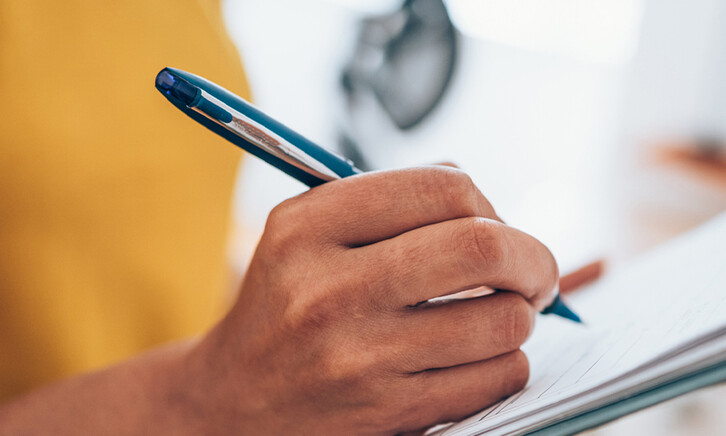 Person with a clipboard checking a list