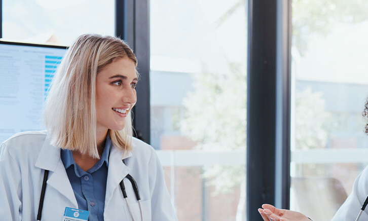 Doctors discussing data in a meeting