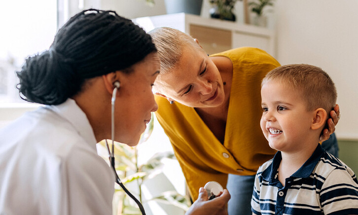 Pediatrician working with patient