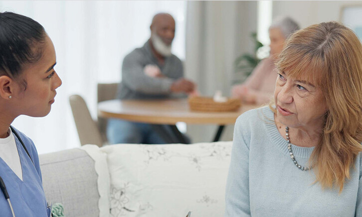 nurse talks to senior