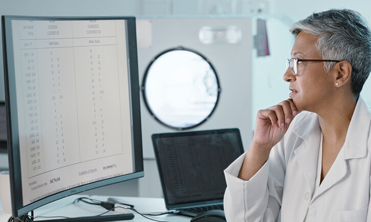 doctor's look at computer monitor together