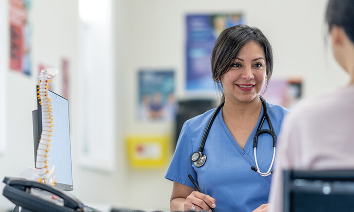 nurse talks to patient