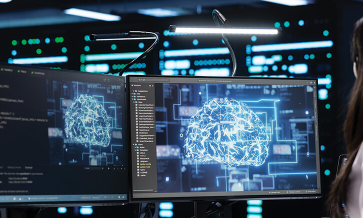 women on computer with digital brain