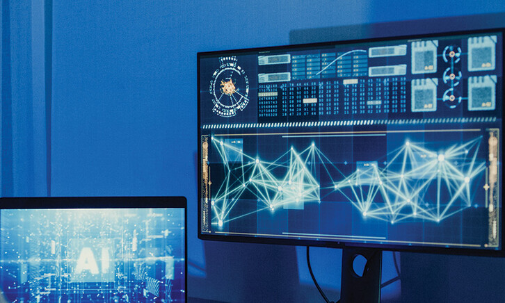 developer works on AI algorithm on multiple monitors