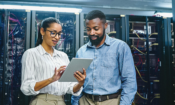 IT specialists collaborate in data center