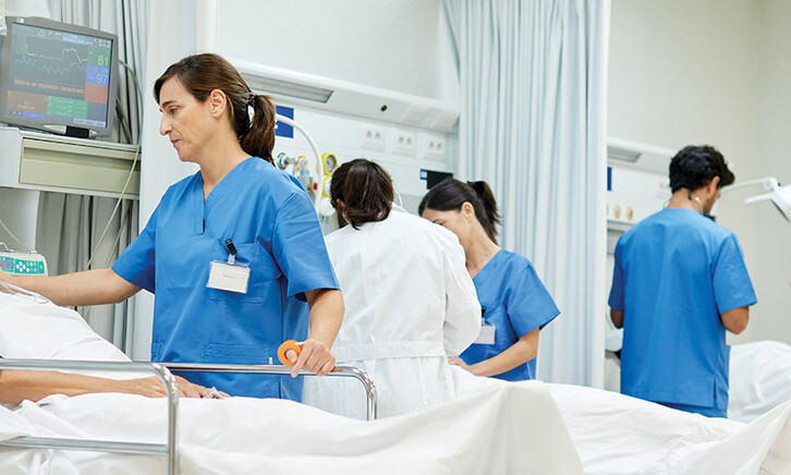 nurses talk to patients on gurneys