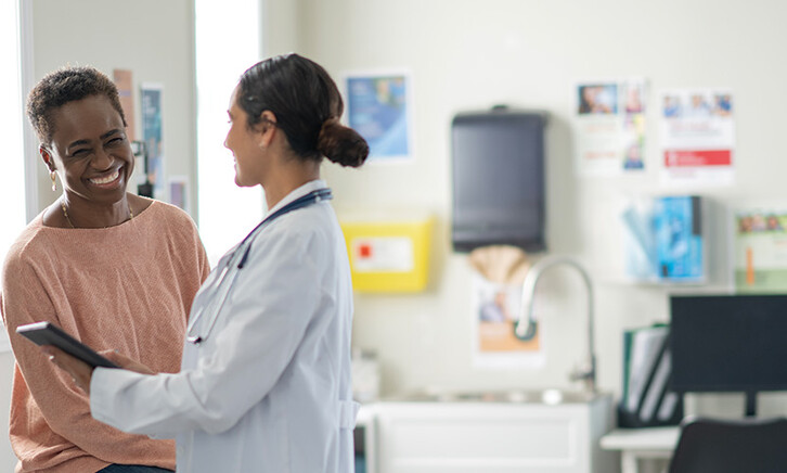 doctor and patient smiling at appointment