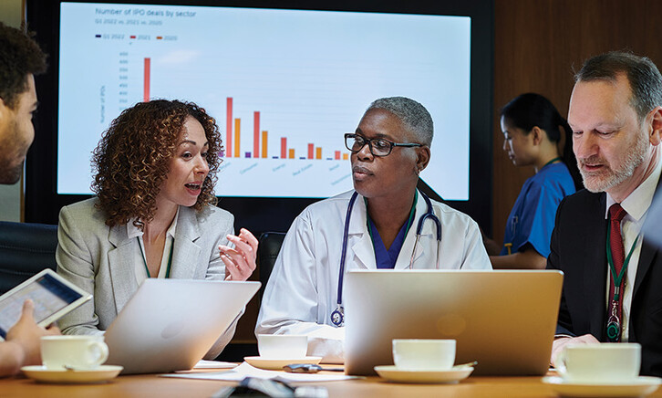 clinicians and IT team meeting