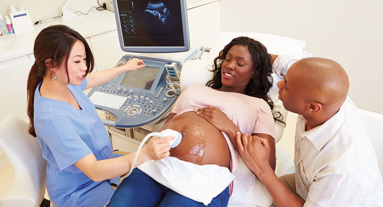 Black couple attends ultrasound appointment