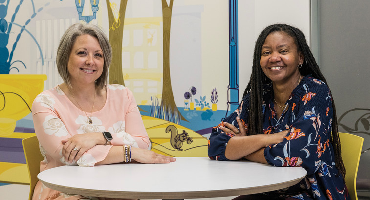 Quality Initiative Specialist Erin Pitchure (left) and Clinical Informatics Specialist Ericka Moore worked together to build a new analytics system at Akron Children's in Ohio.