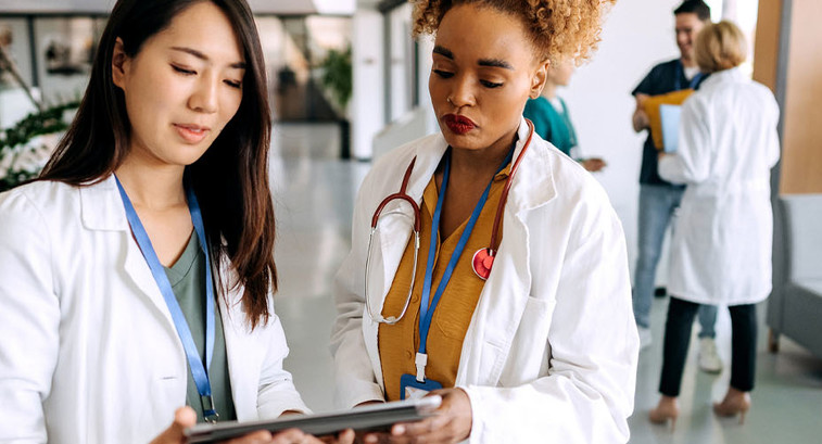Doctors talking in hospital corridor