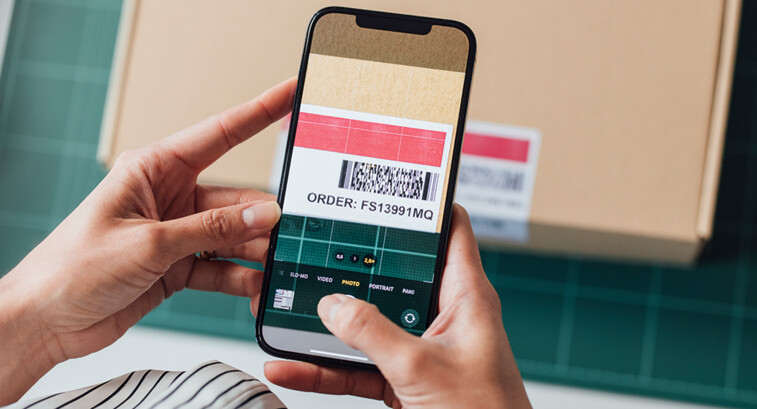 person scans barcode with phone