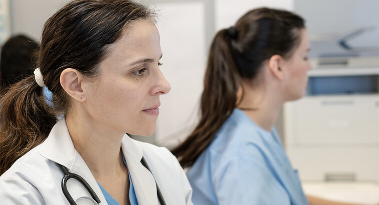 Doctors using computers in a hospital