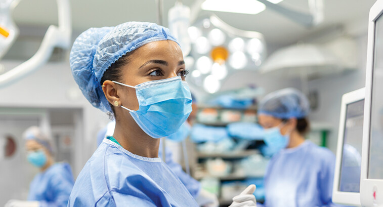 nurse check monitor in the OR