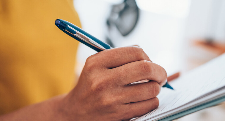 Person with a clipboard checking a list