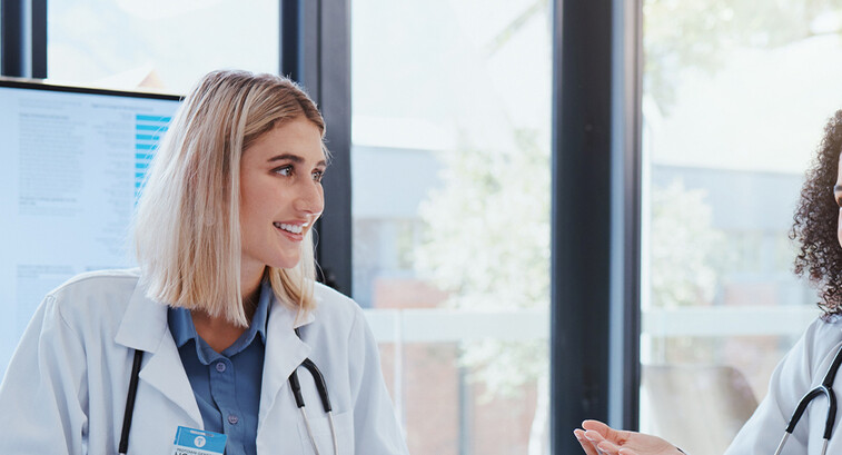 Doctors discussing data in a meeting