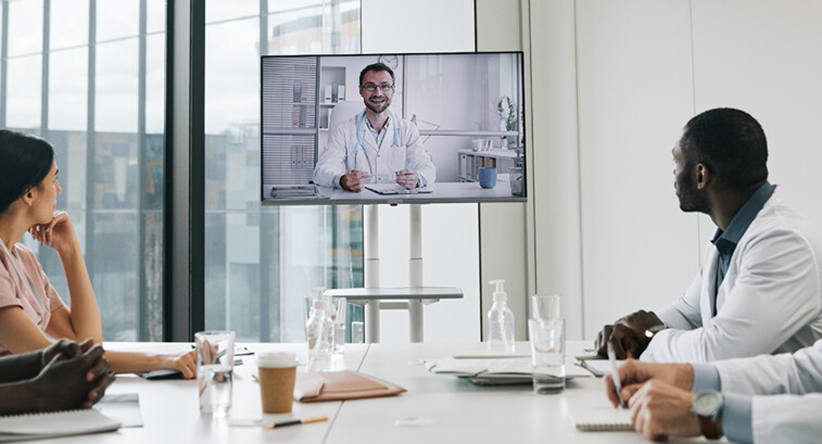care team speaks with physician over conference call