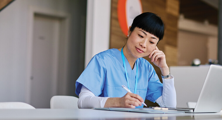 nurse studying on computer