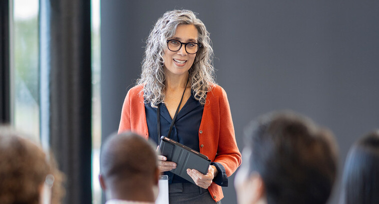 Person presenting at conference
