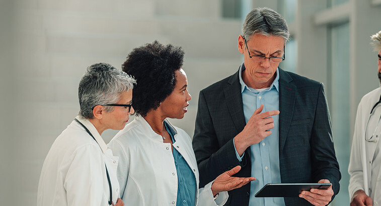 healthcare executive collaborates with physicians