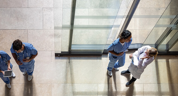 aerial view of doctors and nurses entering a hospital