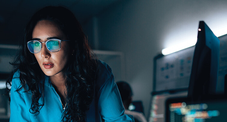 cybersecurity expert surrounded by code