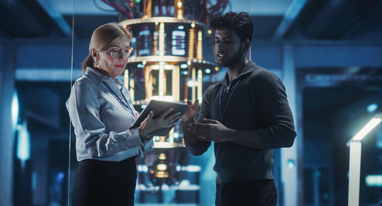 Two people in a tech facility