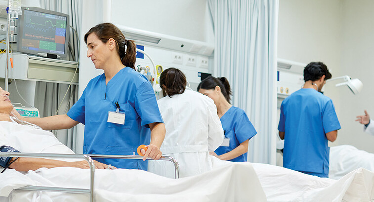 nurses talk to patients on gurneys
