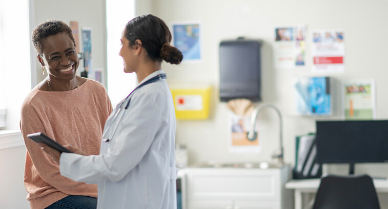 doctor and patient smiling at appointment
