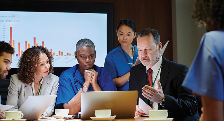 healthcare leaders meet around table
