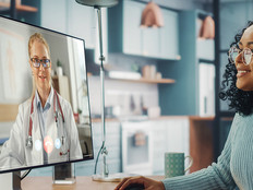 women attends telehealth appointment with doctor