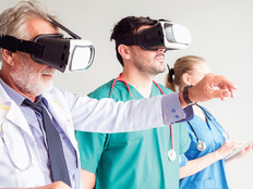group of medical professionals train using VR headsets