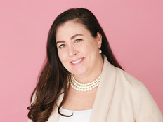 Dr. Sarah Pletcher against pink background