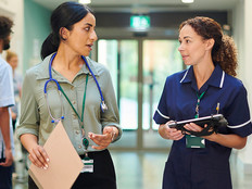 Doctor speaking with nurse in hospital
