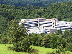 a hospital located in a forested rural area