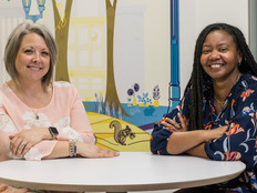 Quality Initiative Specialist Erin Pitchure (left) and Clinical Informatics Specialist Ericka Moore worked together to build a new analytics system at Akron Children's in Ohio.