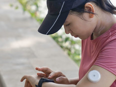 Person wearing glucose monitor 