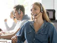 Woman uses headset in call center